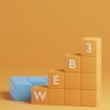 a block tower with the letters b e w on it